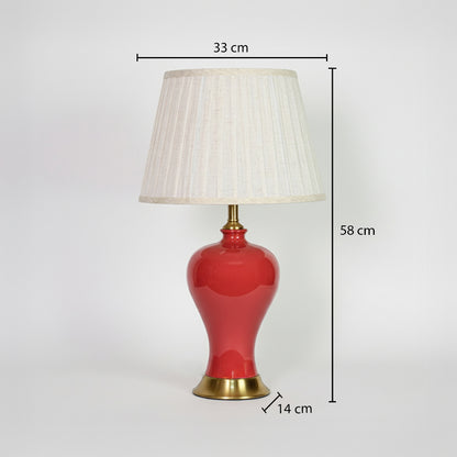 Red ceramic table lamp with fabric shade measuring 58 cm height and 33 cm width for elegant traditional interiors.