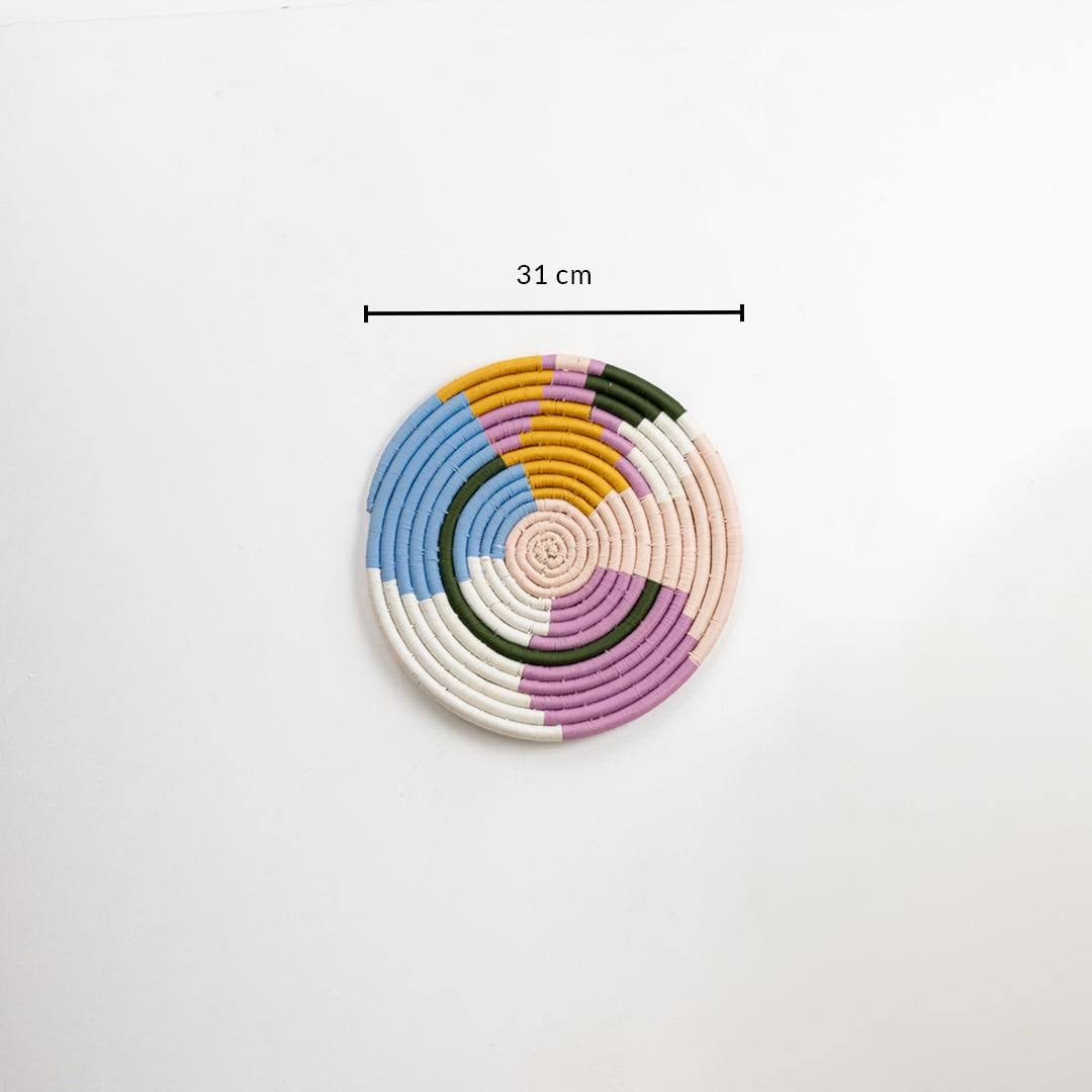 Dimension image of round pastel seagrass wall basket for living room hallway and boho wall décor display.