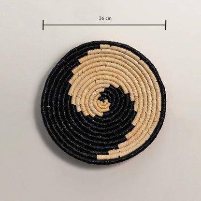 Dimension image of handcrafted black cream seagrass wall basket with yin yang swirl wave pattern for boho wall decor display.