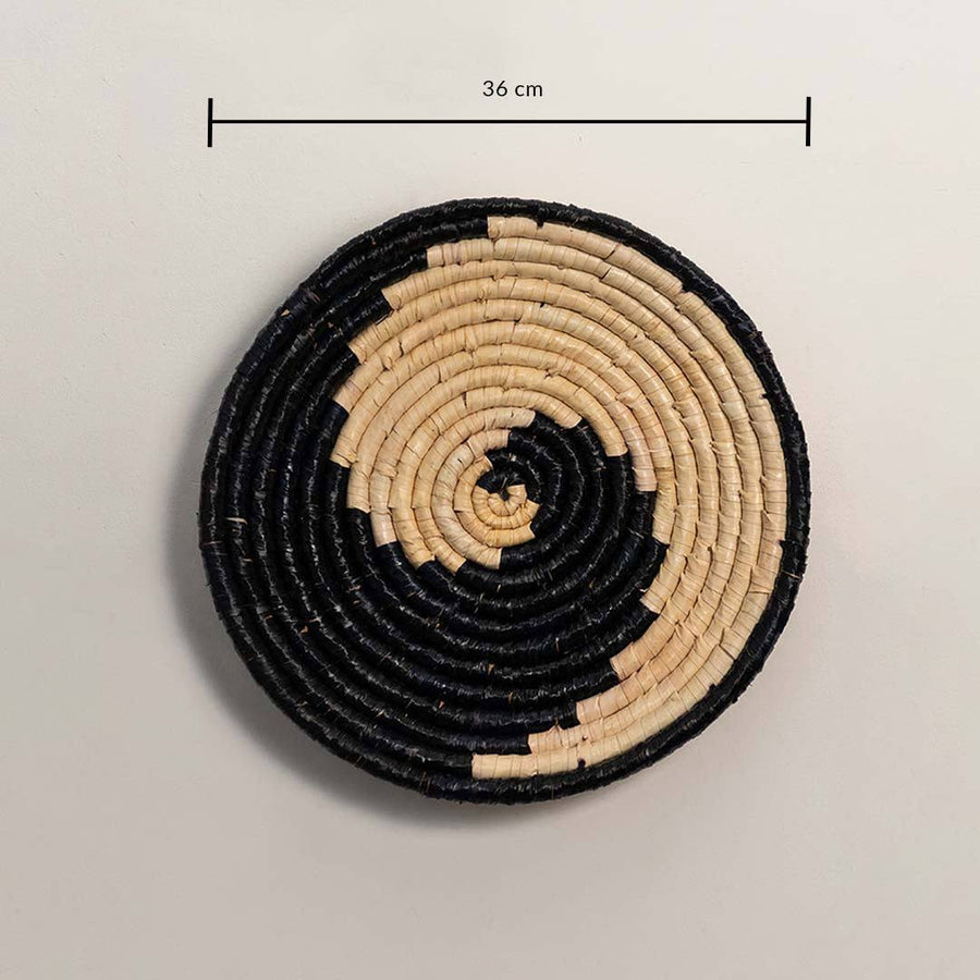 Dimension image of handcrafted black cream seagrass wall basket with yin yang swirl wave pattern for boho wall decor display.