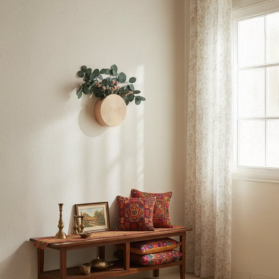 Beige textured round wall planter shown in a clean lifestyle setting ideal for modern home decor and small indoor arrangements.
