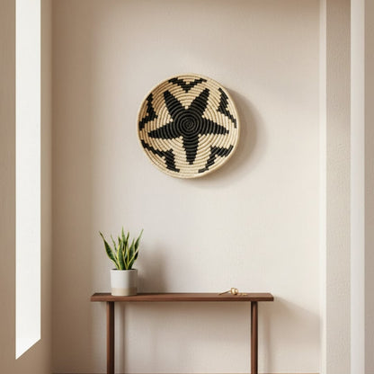 Woven round wall basket styled above slim console table creating natural focal point and calm earthy accent for modern home Decor.