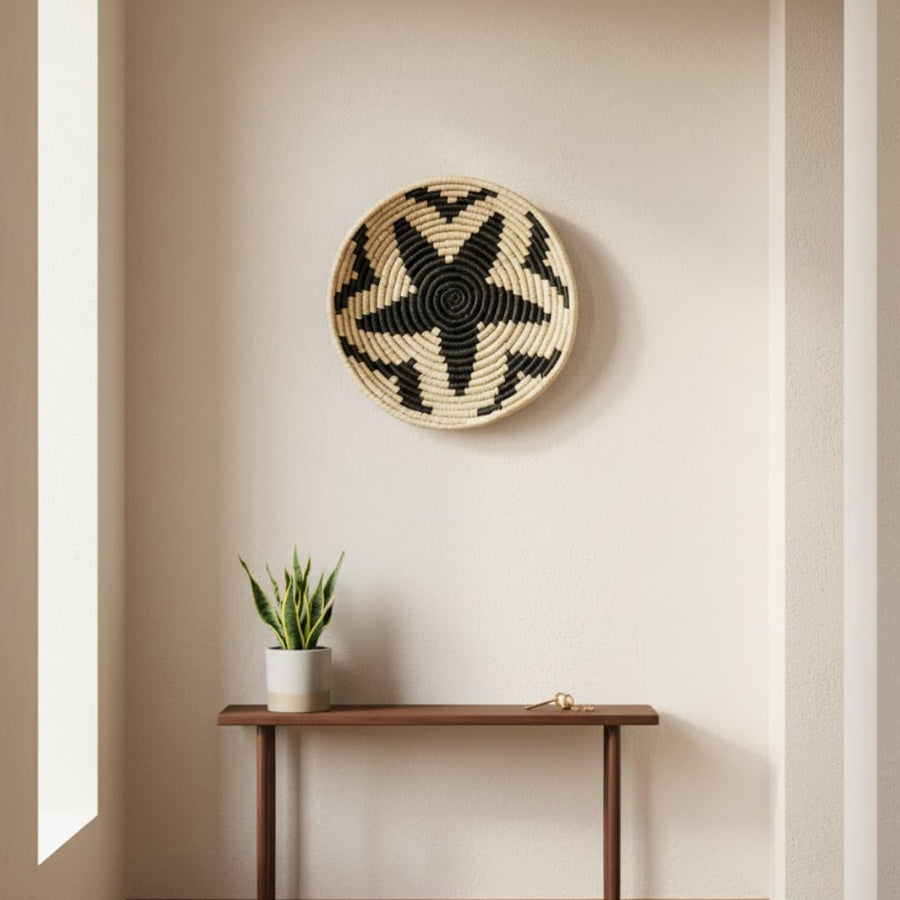 Woven round wall basket styled above slim console table creating natural focal point and calm earthy accent for modern home Decor.