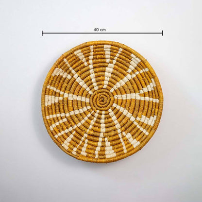 Handwoven seagrass round wall basket decor in natural beige and terracotta with sunburst pattern and size guide.