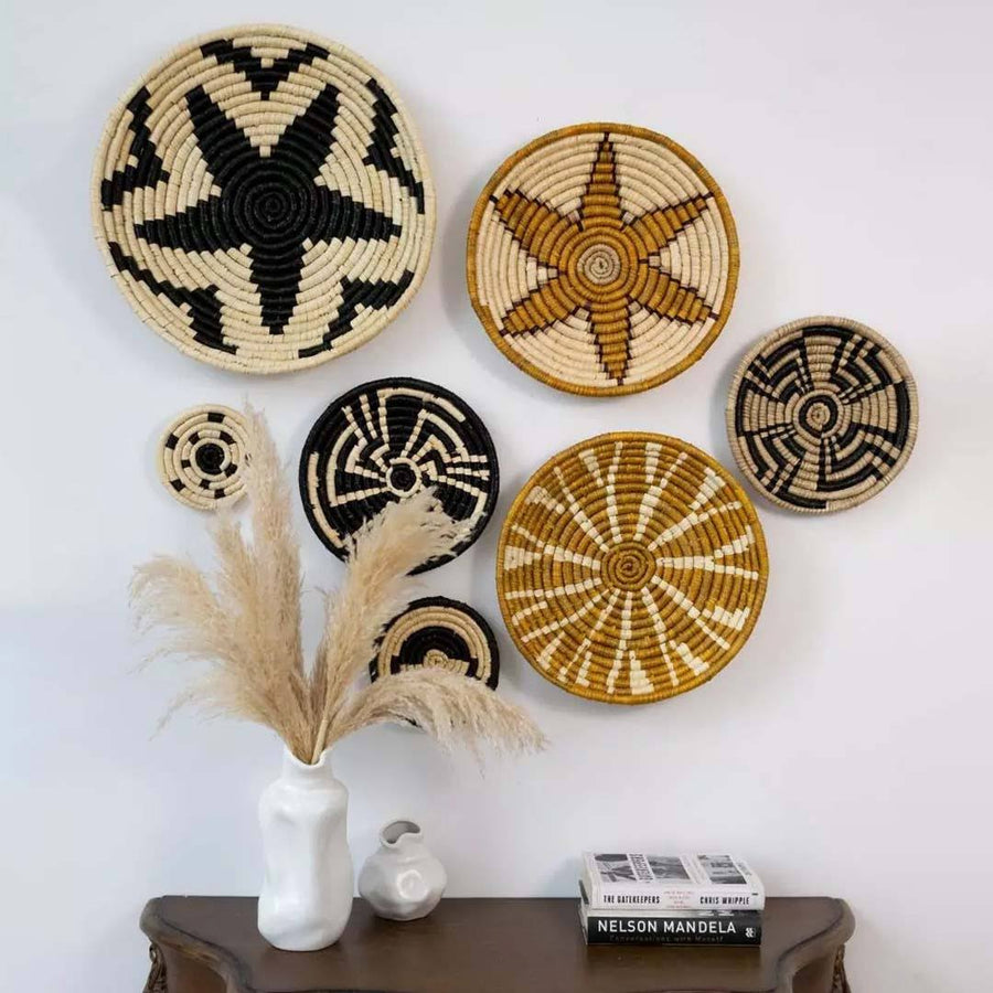 Handwoven seagrass wall basket decor set in natural beige and terracotta creating elegant boho wall decor for home interiors.