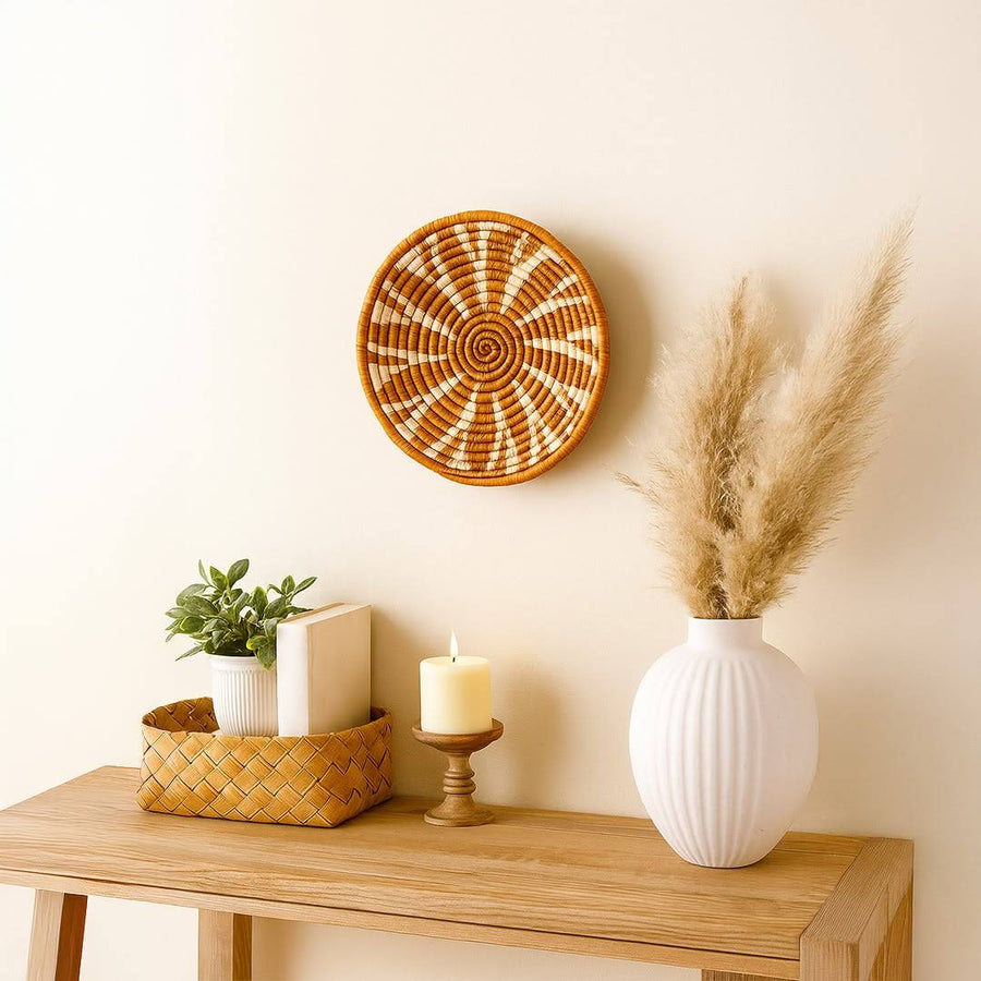 Handwoven seagrass wall basket decor in natural beige and terracotta adding warm boho charm to stylish home interiors.