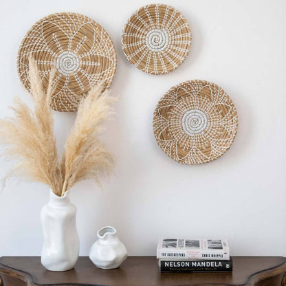 Handwoven seagrass wall basket decor set in natural beige with white accents displayed for elegant boho home wall styling.
