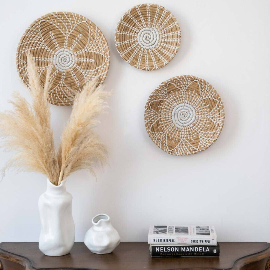Handwoven seagrass wall basket decor set in natural beige with white accents displayed for elegant boho home wall styling.