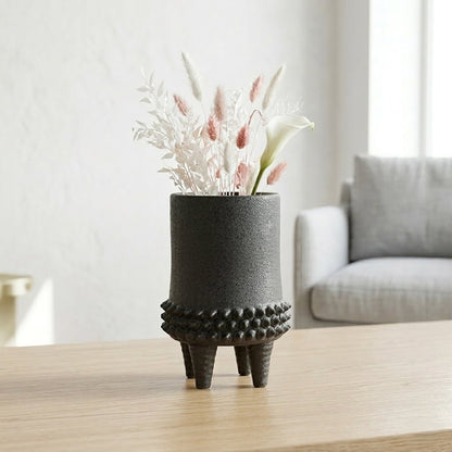 Black ceramic flower vase placed on table modern decorative vase for living room shelf console home decor styling.