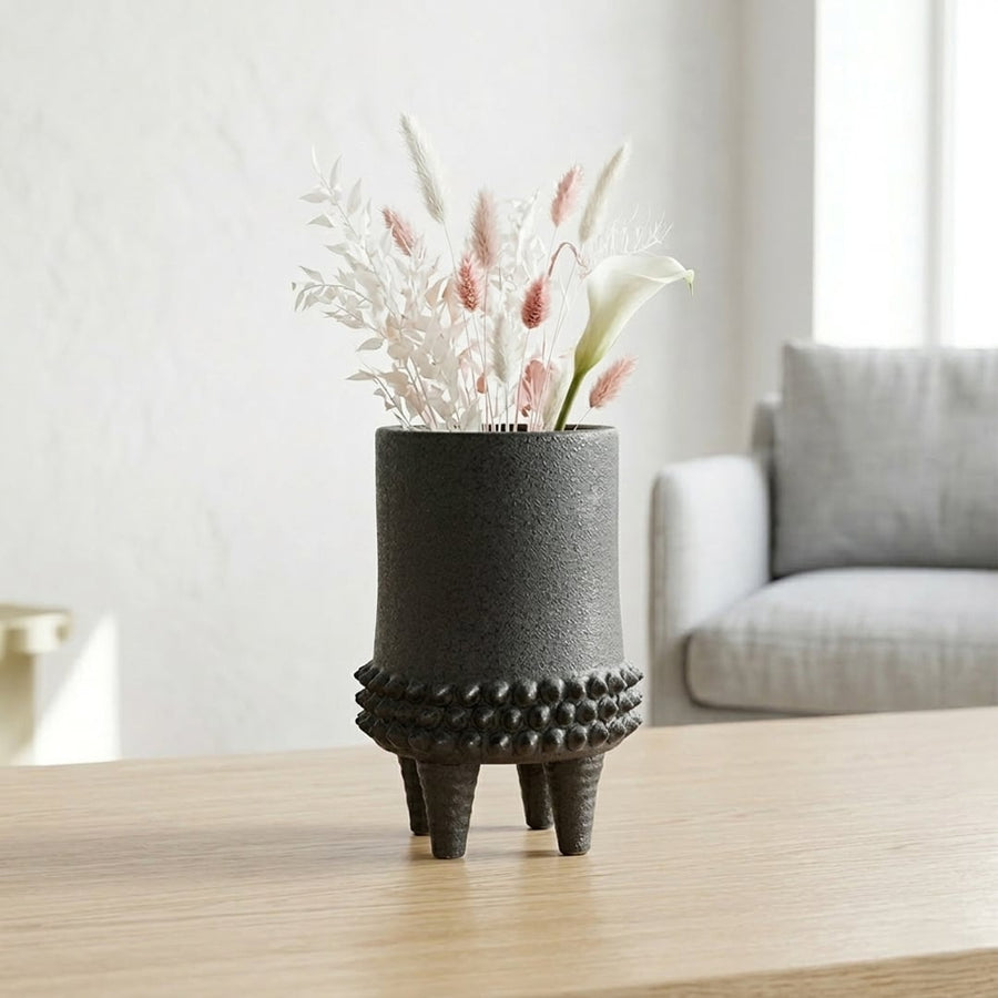 Black ceramic flower vase placed on table modern decorative vase for living room shelf console home decor styling.