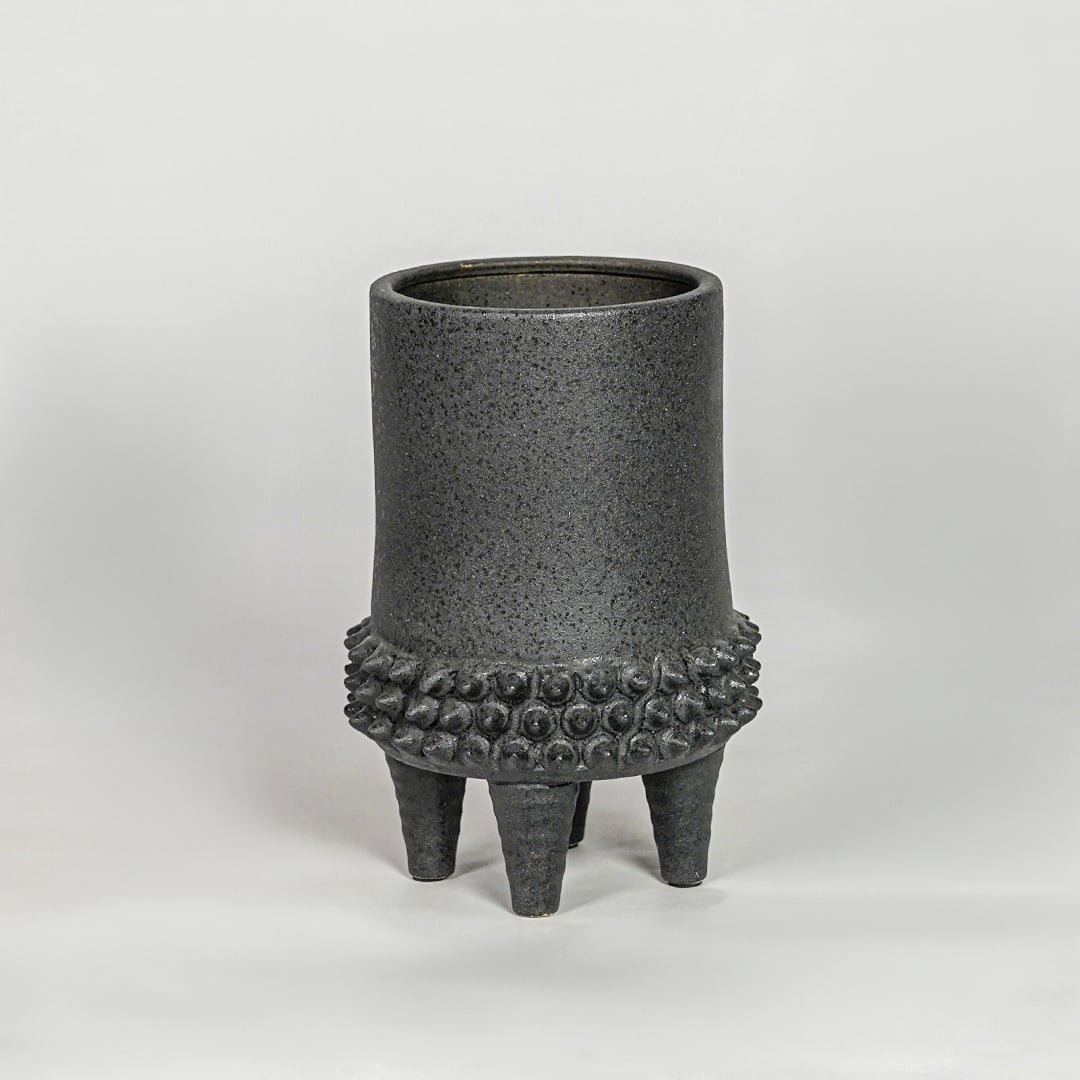 Black ceramic planter vase with textured finish modern decorative pot for tabletop shelf console living room decor styling.