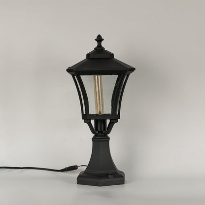 Black outdoor gate light with clear textured glass panels for stylish exterior decor use.