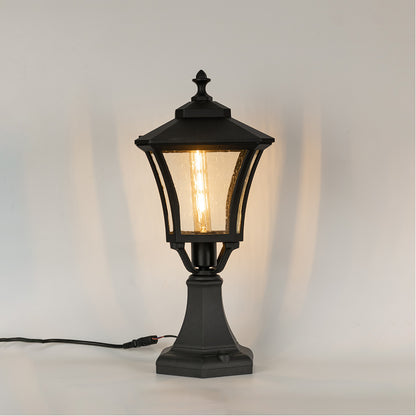 Vintage black outdoor gate light with warm glowing bulb for elegant exterior decor styling use.