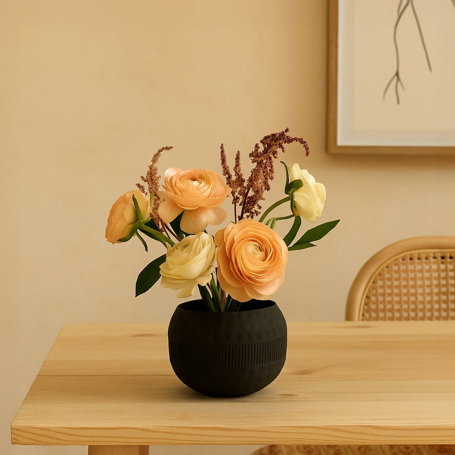 Modern black metal textured bowl decor styled on a warm tabletop adding an elegant accent to living room spaces.