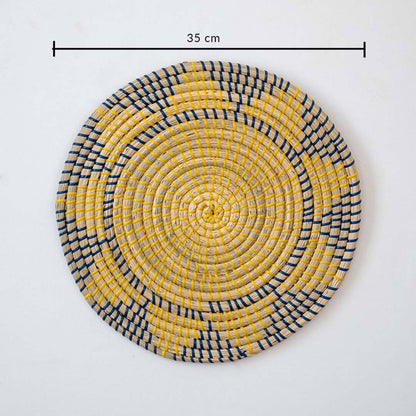 Handwoven seagrass round wall basket decor in yellow and charcoal with geometric woven pattern and size guide on white.