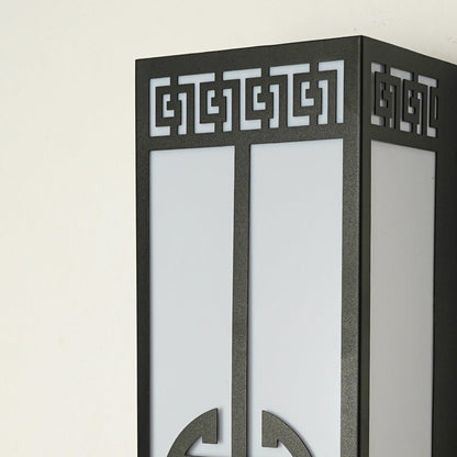 Close view of outdoor wall light with intricate geometric metal detailing showcasing premium exterior lighting craftsmanship.
