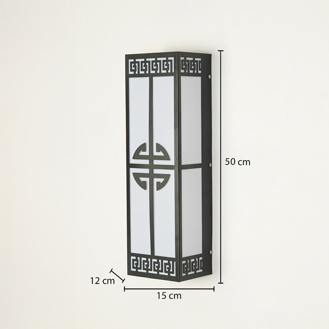 Decorative outdoor wall light with black metal frame and geometric pattern panel on neutral background 50 cm height 15 cm width 12 cm depth ideal for outdoor walls.