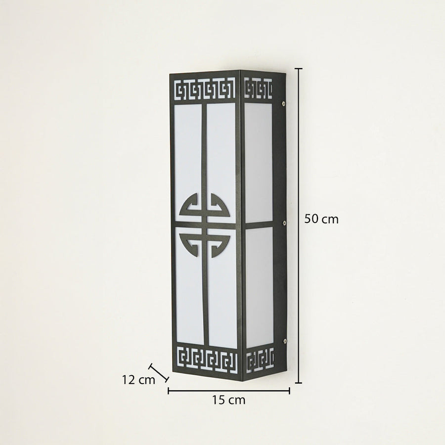 Decorative outdoor wall light with black metal frame and geometric pattern panel on neutral background 50 cm height 15 cm width 12 cm depth ideal for outdoor walls.