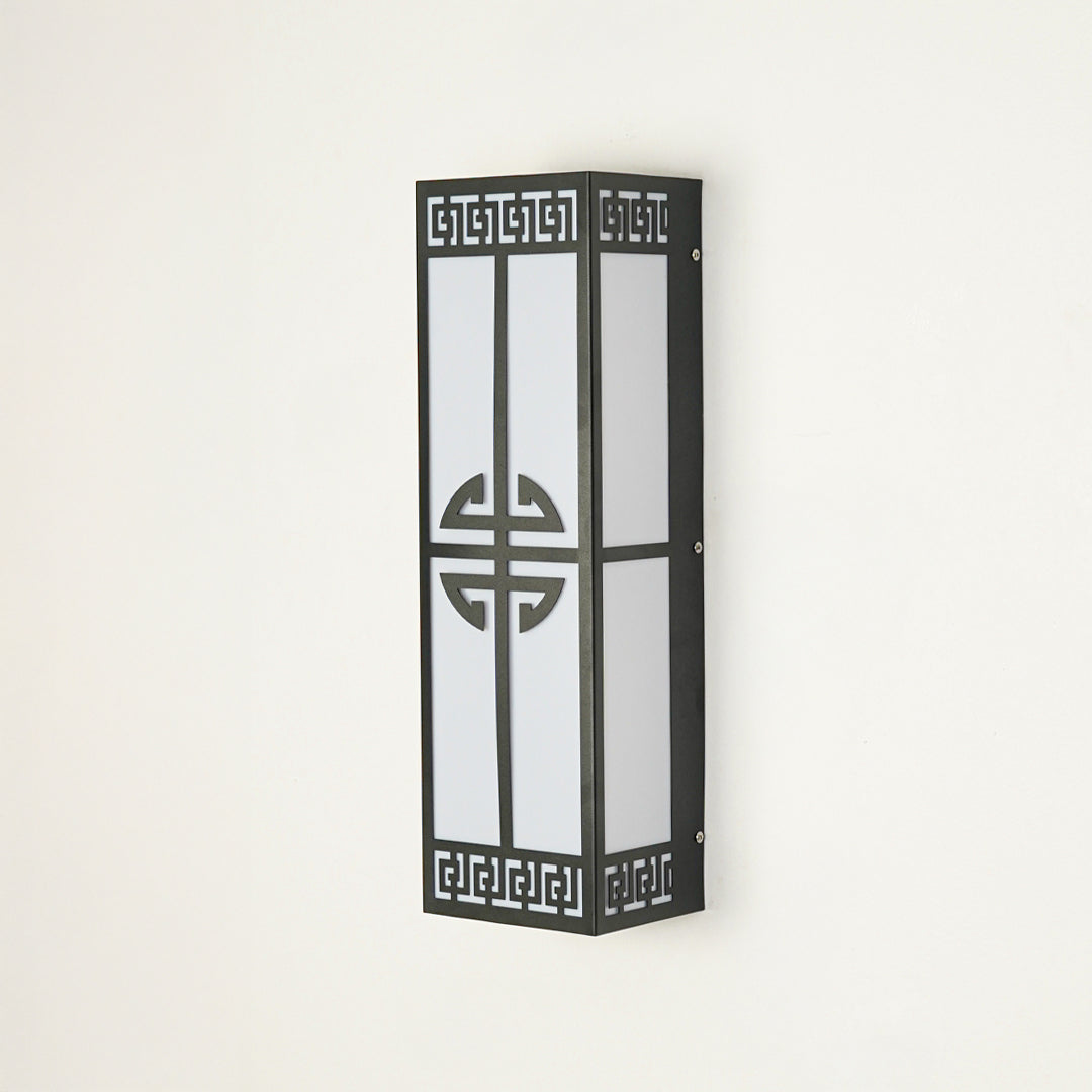 Contemporary outdoor wall sconce with black metal frame and patterned design on clean background perfect for porch or entryway lighting.