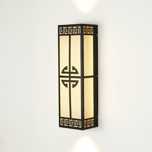 Decorative outdoor wall light with geometric metal pattern and frosted glass panel mounted on neutral wall background ideal for modern exterior lighting.