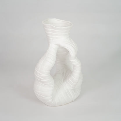 White sculptural ceramic vase for stylish shelf placement and contemporary living room decor styling statement piece.