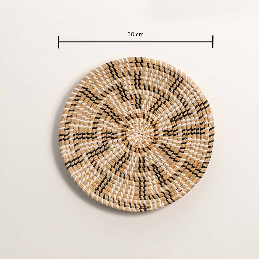 Dimension image of handcrafted black natural seagrass wall basket with geometric spoke wheel pattern for boho wall decor.