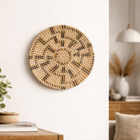 Natural woven wall basket displayed above a console table for elegant bohemian wall decor and modern home interiors.