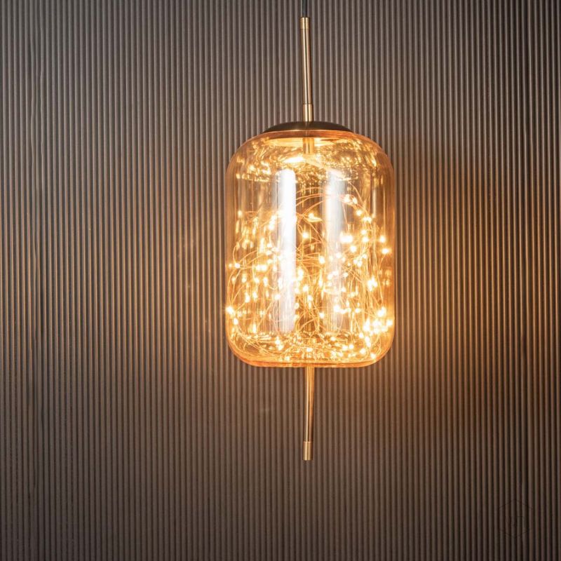 Amber Glass Hanging Lamp Cylinder Light On Black Background