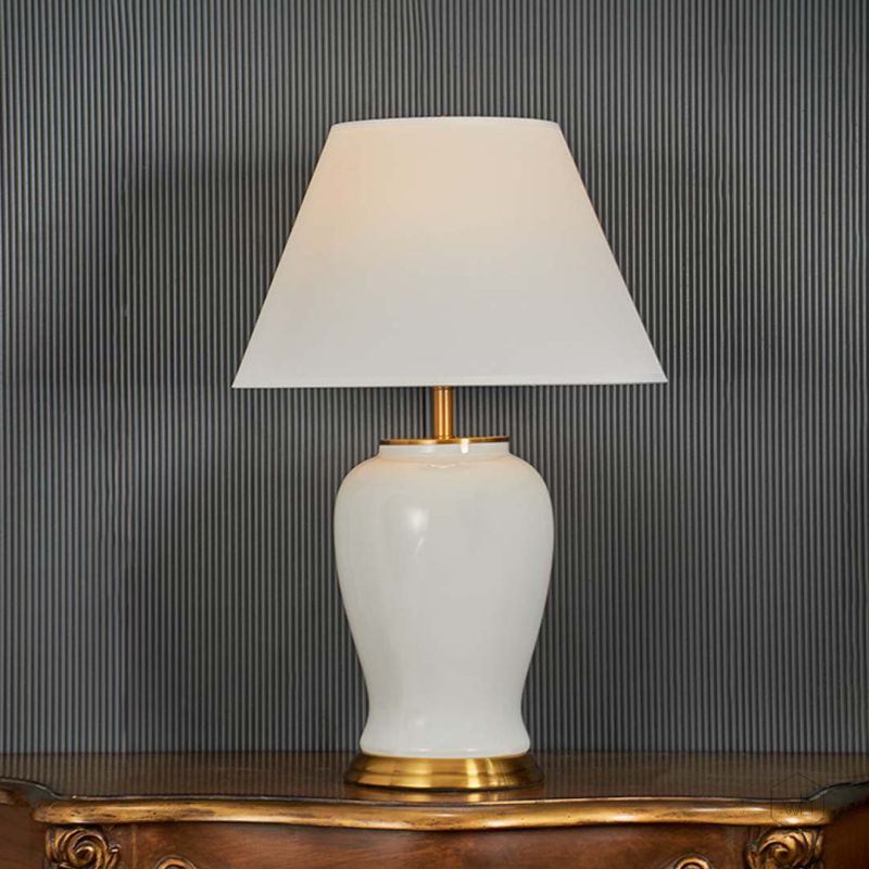 Shiny White Ceramic Table Lamp Light On Black Background
