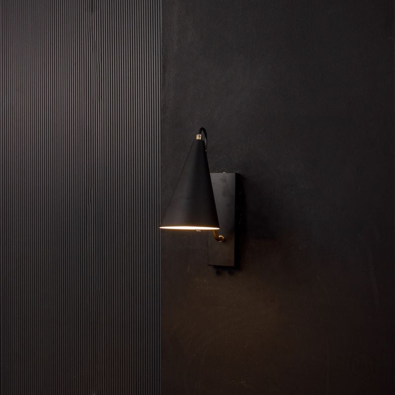 Kalika Modern Wall Sconce Black Light On Black Background