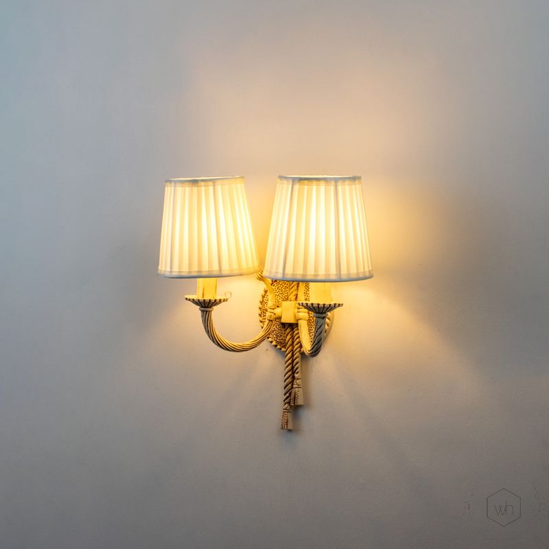 Antique 2 Light Wall Lamp with Pleated Fabric Shades Light On White Background