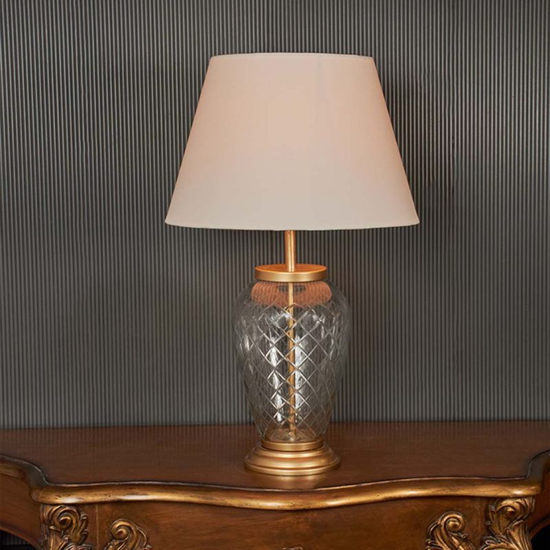 Diamond Cut Antique Brass Finish Glass Table Lamp with Off White Shade - Large Light On Black Background