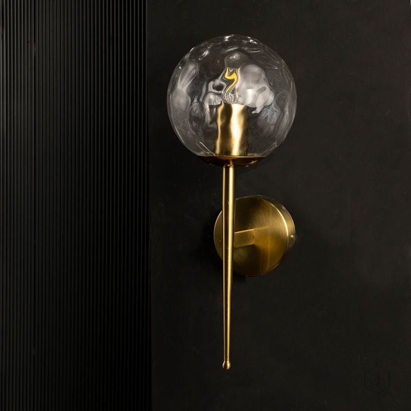 Mid-Century Style Round Clear Glass Golden Wall Lamp Light Off Black Background