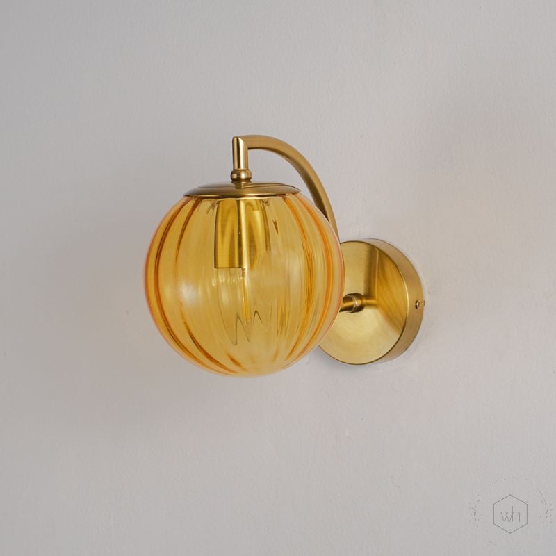 Modern Globe Brass Wall Light - Gold Light Off White Background