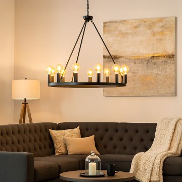 Elegant black metal hoop chandelier with vintage Edison bulbs suspended from chain creating dramatic statement lighting fixture.