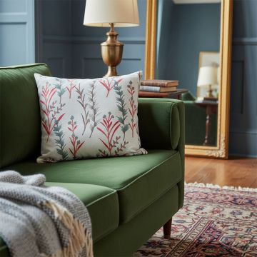 Soft cotton cushion cover with pink floral design stacked with matching covers offering a warm nature inspired look that elevates home décor with a smooth skin friendly texture.