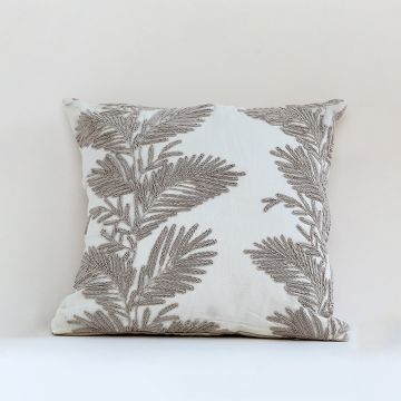Soft cotton cushion cover with beige botanical embroidery shown in a front view offering an elegant nature inspired décor accent with a breathable gentle and skin friendly fabric finish.