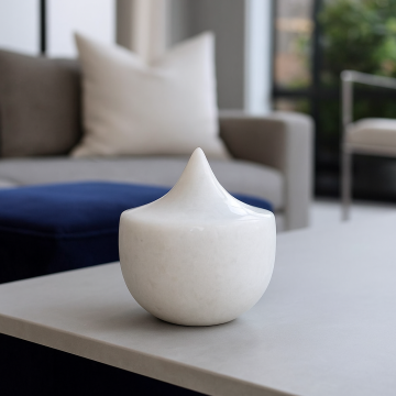 Elegant white ceramic decor piece with a modern peak design placed on a clean white background. Ideal for home decor or office placement.