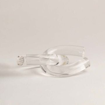Clear glass knot decorative accent shown on white background highlighting its elegant sculptural design for home styling.