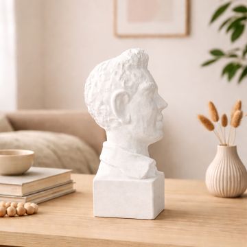 White resin bust sculpture placed on wooden console table adding classic artistic charm to modern living room decor.