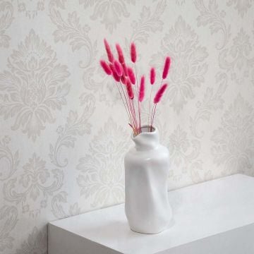 Bright pink dried bunny tail stems styled in a soft modern room adding playful natural texture to home decor.