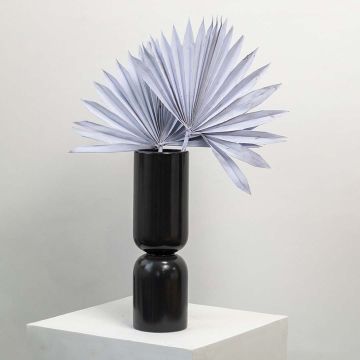 Light purple dried palm leaves in tall black vase styled for modern home decor and boho table decoration.