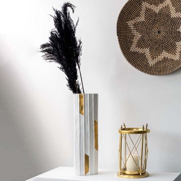 Black pampas grass arrangement in vase creating elegant decorative accent for living room or bedroom styling.