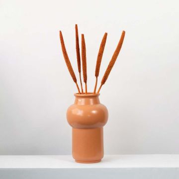 Black bulrush stems displayed in a contemporary setting with minimalist sculpture perfect for luxury home decor.