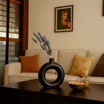 Grey lagurus bunny tail grass bouquet styled in elegant black vase lifestyle home decor arrangement display.