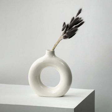Black lagurus dried bunny tail grass styled in modern white ceramic vase lifestyle minimal home decor display.