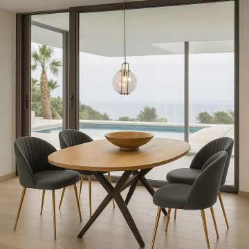 Bright dining area overlooking a pool with a spherical glass and metal pendant light suspended over a wooden table creating a clean modern atmosphere.