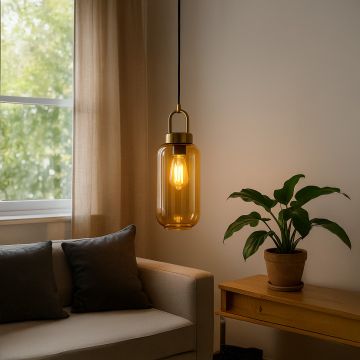 A modern gold and amber glass pendant light glowing warmly beside a sofa creating soft ambient lighting ideal for living rooms bedrooms and cozy interiors.