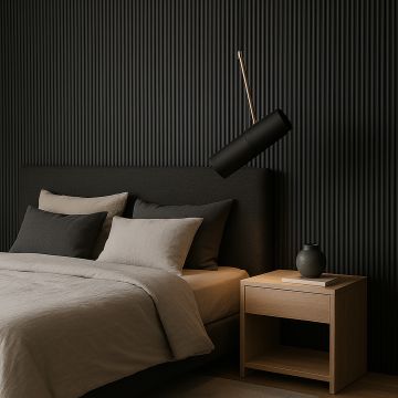 Modern black cylindrical pendant light with golden accent glowing above bed stylish ceiling lamp for luxury bedroom interiors