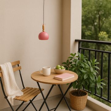Terracotta dome pendant light with wooden accent styled in cozy interior adding warm modern touch to home lighting.